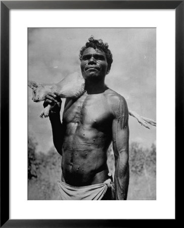Australian Aborigine Holding A Freshly Killed Animal Used As A Food Source by Fritz Goro Pricing Limited Edition Print image