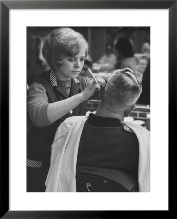 Female Barber Cutting A Customer's Hair In A Barber Shop by Ralph Crane Pricing Limited Edition Print image