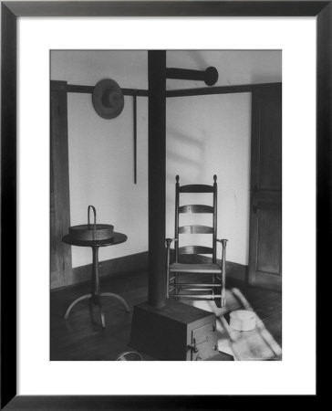Iron Woodstove With A Ladder Backed Wooden Armchair In A Restored Shaker Parlor by John Loengard Pricing Limited Edition Print image