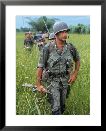 Us Army Captain Robert Bacon Leading A Patrol During The Early Years Of The Vietnam War by Larry Burrows Pricing Limited Edition Print image