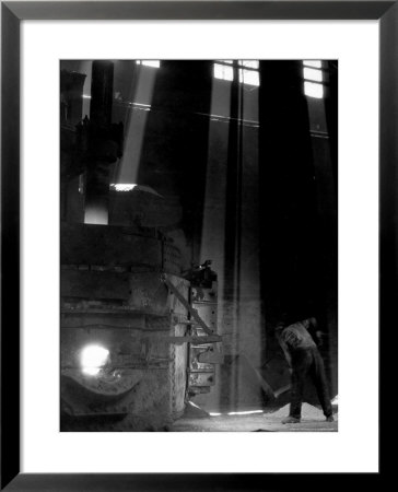 Worker Shoveling Limestone Into An Electric Blast Furnace At Republic Steel Mill by Margaret Bourke-White Pricing Limited Edition Print image