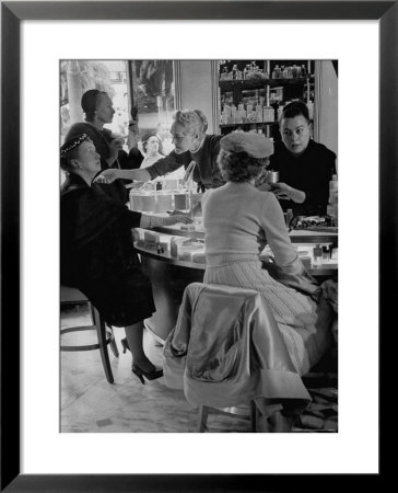 Women At A Powder Bar In Department Store Being Advised On Make Up By Operators by Leonard Mccombe Pricing Limited Edition Print image