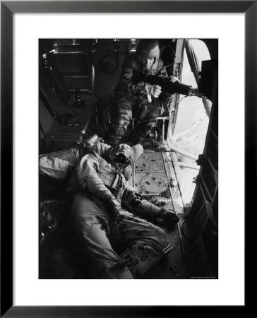 Helicopter Chief James C. Farley Working Jammed Machine As Pilot Lt. James Magel Dying Beside Him by Larry Burrows Pricing Limited Edition Print image