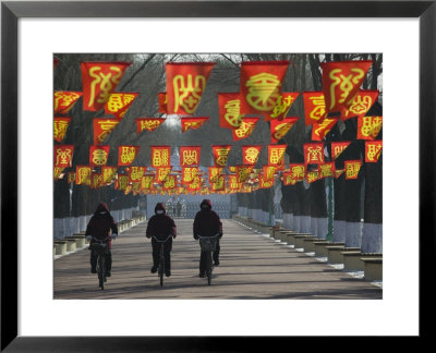 Bicycle Riders At Entranceway To Festival, Ice And Snow Festival, Harbin, Heilongjiang, China by Walter Bibikow Pricing Limited Edition Print image