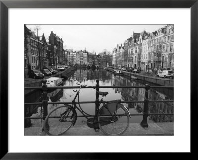 Black And White Imge Of An Old Bicycle By The Singel Canal, Amsterdam, Netherlands, Europe by Amanda Hall Pricing Limited Edition Print image