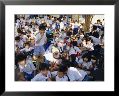 School Children At The End Of The Day At School, Ho Chi Minh City, Vietnam, Indochina by Tim Hall Pricing Limited Edition Print image