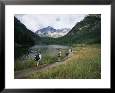 Group Of Hikers In Front Of The Maroon Bells, In Colorado by Taylor S. Kennedy Pricing Limited Edition Print image