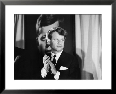 Robert F. Kennedy Campaigning In Front Of Poster Portrait Of His Brother President John F. Kennedy by Bill Eppridge Pricing Limited Edition Print image