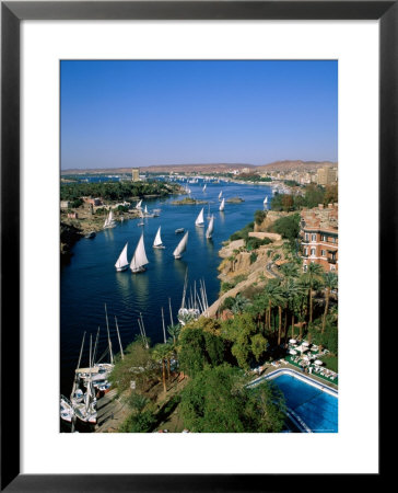 Nile River, Feluccas On The Nile River And Old Cataract Hotel, Aswan, Egypt by Steve Vidler Pricing Limited Edition Print image