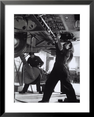 Workers During A Phase Of The Construction Of An Airplane At The Caproni Factory At Predappio by A. Villani Pricing Limited Edition Print image