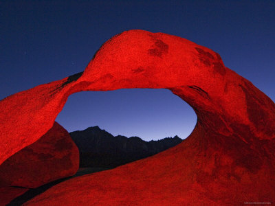 Night Photo Of Rock Arch With Colored Flash, Alabama Hills, California, Usa by Dennis Kirkland Pricing Limited Edition Print image