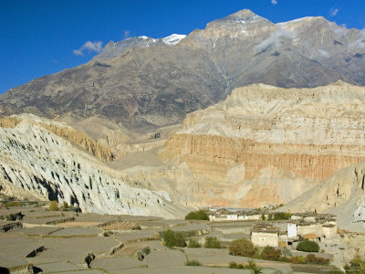 Small Village With Terraced Fields In Mustang, Nepal by Stephen Sharnoff Pricing Limited Edition Print image