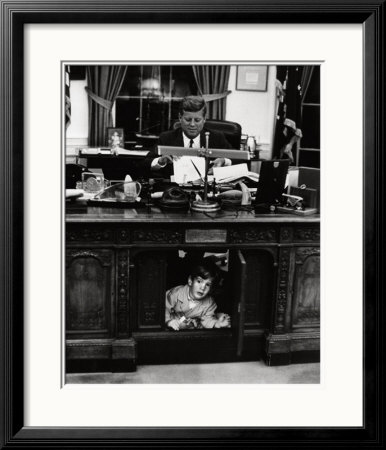 John Jr. Playing Under John F. Kennedy's Oval Office Desk, 1963 by Stanley Tretick Pricing Limited Edition Print image