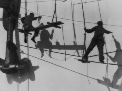 Shadows And Silhouettes Of Shipyard Workers Suspended In Rope Rigging by J. Kauffmann Pricing Limited Edition Print image