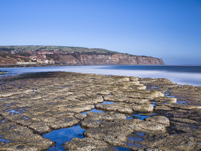 Boggle Hole And Robin Hood's Bay On A Sunny Winter's Day, North Yorkshire, Yorkshire, England, Unit by Lizzie Shepherd Pricing Limited Edition Print image