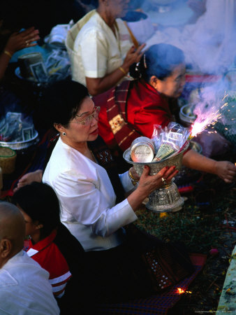 Local People Presenting Alms To The Monks At Pha That Luang Temple- Vientiane, Laos by Juliet Coombe Pricing Limited Edition Print image