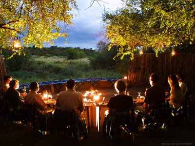 Guests At Tented Camp Boma On An Evening Game Watch, Mashatu Game Reserve, Botswana by Roger De La Harpe Pricing Limited Edition Print image
