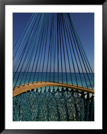 The Turquoise Caribbean Sea Viewed Through Turquoise Hammock Strings by Raul Touzon Pricing Limited Edition Print image