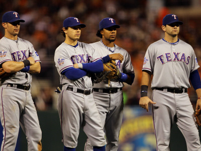 Texas Rangers V San Francisco Giants, Game 2: Michael Young, Ian Kinsler, Elvis Andrus, Mitch Morel by Doug Pensinger Pricing Limited Edition Print image