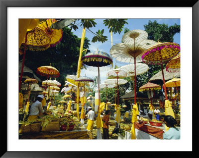 Parasols In Taman Pile Hindu Temple On Koningan Day, Bali, Indonesia by Robert Francis Pricing Limited Edition Print image