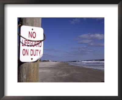 An Ironic Sign Warns No Lifeguard On A Totally Empty Beach by Stephen St. John Pricing Limited Edition Print image