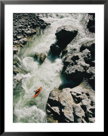 A Kayaker Braves The Swift River Through The Jagged Rocks by Skip Brown Pricing Limited Edition Print image