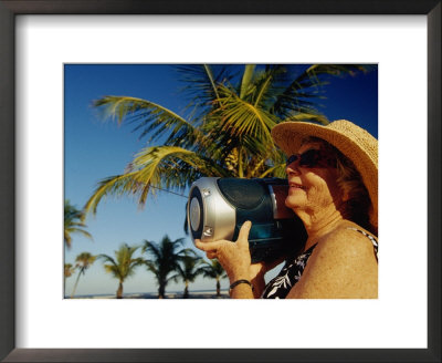 Mature Woman Listens To Radio On Florida Beach by Len Rubenstein Pricing Limited Edition Print image