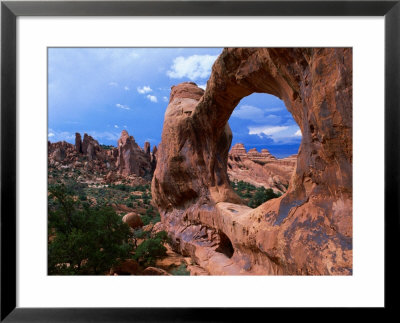 Looking Through An Arch In Arches National Monument, Utah, Arches National Park, Usa by Mark Newman Pricing Limited Edition Print image