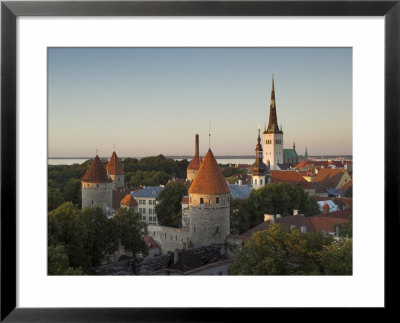 Medieval Town Walls And Spire Of St. Olavs Church At Dusk, Tallinn, Estonia, Baltic States, Europe by Neale Clarke Pricing Limited Edition Print image