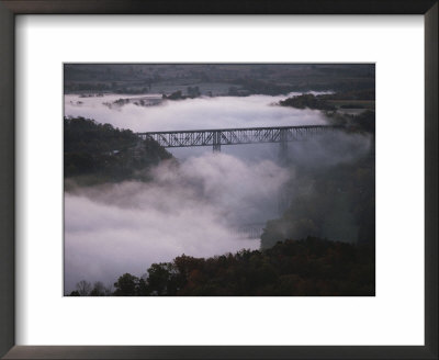 A Railroad Bridge Crosses A Fog-Bound River by Sam Abell Pricing Limited Edition Print image