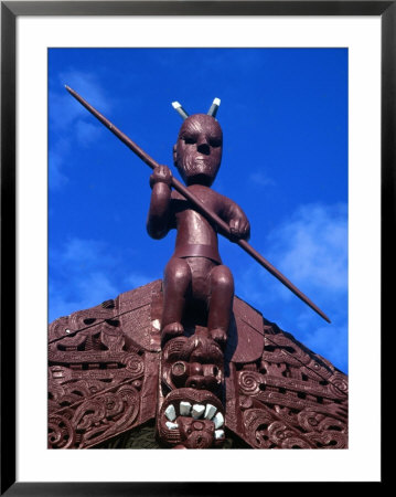 Carving On Top Of Meeting House In Maori Communal Centre At Ohinemutu Maori Village, New Zealand by Krzysztof Dydynski Pricing Limited Edition Print image