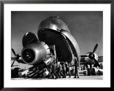 Crewmen Unloading Huge B50 Bomber Plane Engine Used As A Spare From The Belly Of A C124 Cargo Plane by Margaret Bourke-White Pricing Limited Edition Print image