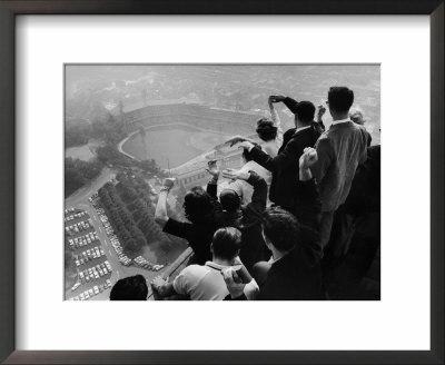 University Of Pittsburgh Students Cheering From Atop Cathedral Of Learning On School's Campus by George Silk Pricing Limited Edition Print image