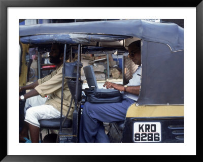 Man Uses Laptop In Back Seat Of Rickshaw, India by Steve Starr Pricing Limited Edition Print image