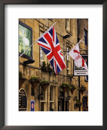 Flags Hanging Outside A Pub, Stow-On-The-Wold, Gloucestershire, England by Glenn Beanland Pricing Limited Edition Print image