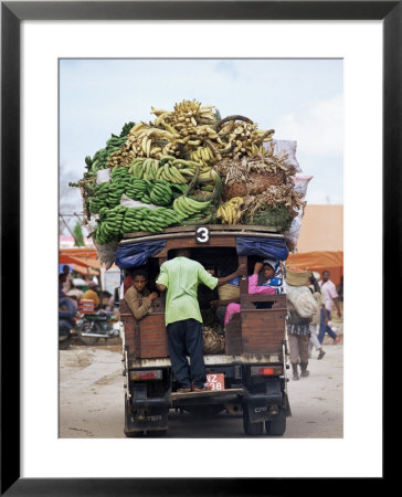 Van Loaded With Bananas On Its Roof Leaving The Market, Stone Town, Zanzibar, Tanzania by Yadid Levy Pricing Limited Edition Print image