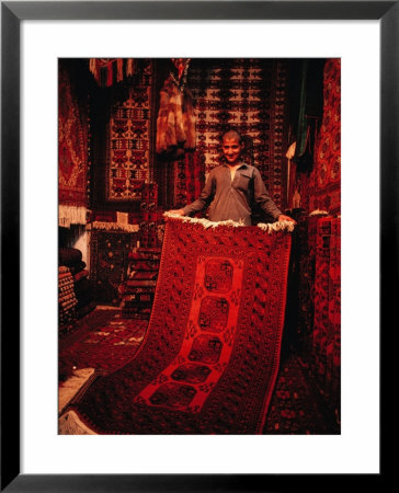 Carpet Trader Displaying A Woolen Carpet, Peshawar, North-West Frontier Province, Pakistan by Richard I'anson Pricing Limited Edition Print image