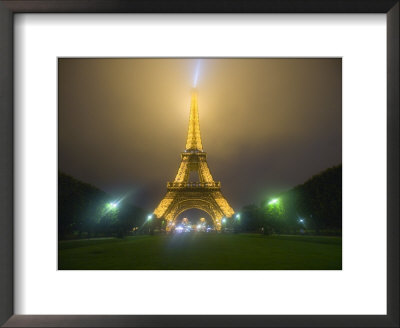 Eiffel Tower Illuminated In Fog And Rain At Night, Paris, France by Jim Zuckerman Pricing Limited Edition Print image