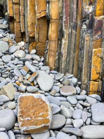 Rock Formations And Pebbles At Sandymouth Bay In North Cornwall, England by Adam Burton Pricing Limited Edition Print image