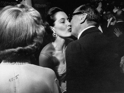 Cyd Charisse Kissing Jack Benny At His Daughter's Wedding by Loomis Dean Pricing Limited Edition Print image