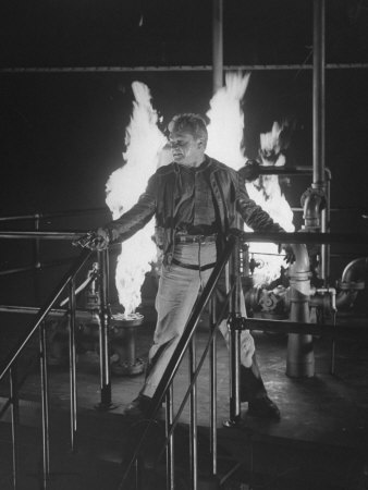 Actor James Cagney, Holding A Revolver In A Scene From Movie White Heat by Allan Grant Pricing Limited Edition Print image