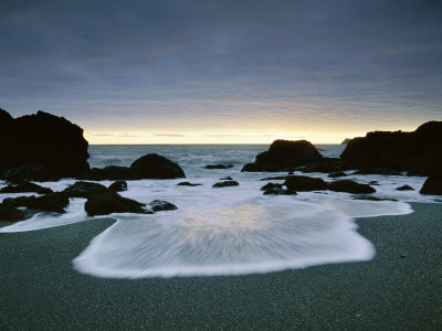 Foamy Wave Rolls Up Rocky Beach, Californian Coastline, Usa by Bob Cornelis Pricing Limited Edition Print image