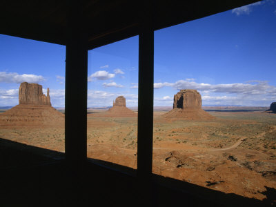 Visitor Center's Windows Frame The Two Mittens And Merrick Buttes by Stephen St. John Pricing Limited Edition Print image