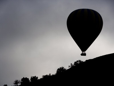 Hot Air Ballon Flys Over Ridge Of Mountain by Scott Stulberg Pricing Limited Edition Print image