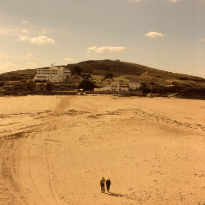 Two Small People On A Large, Deserted Beach by Vanessa Wagstaff Pricing Limited Edition Print image