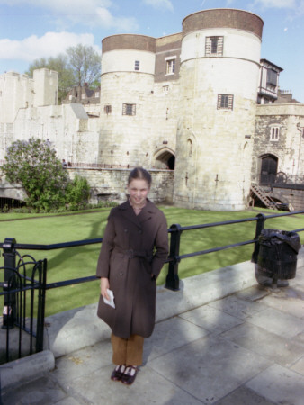 A Young Girl Poses For A Photograph Outside The Walls Of The Tower Of London by Vanessa Wagstaff Pricing Limited Edition Print image