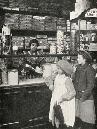 Olive Malvery Serving In A Sweet Shop by Peter Higginbotham Pricing Limited Edition Print image