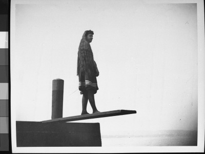 Young Miss Hall, With Very Long Hair, Standing On A Springboard And Contemplating Whether To Jump by Wallace G. Levison Pricing Limited Edition Print image