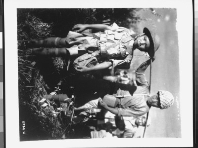 10-Yr-Old Chinese Soldier With Heavy Backpack, Boarding Planes At North Airstrip, During Wwii by Henry Allen Pricing Limited Edition Print image