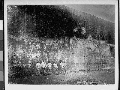 Prisoners Kneeling, Awaiting Execution In Front Of Bullet-Scarred Wall, Spanish American War by E.C. Rost Pricing Limited Edition Print image